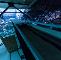 Close up of assembly line producing fiberglass heavy industry machinery metalworking workshop concept.